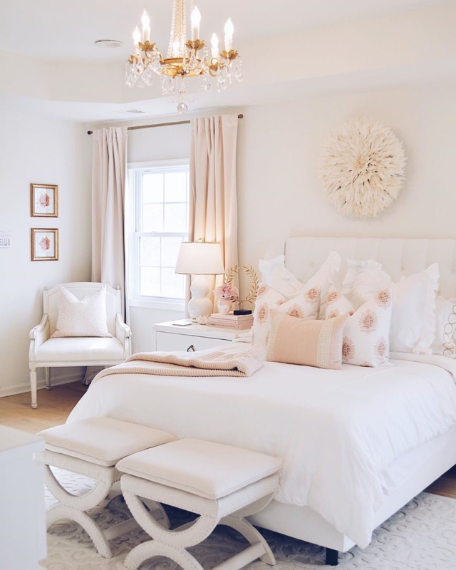 Cream Bed With Tufted Headboard And Pink Velvet Stools