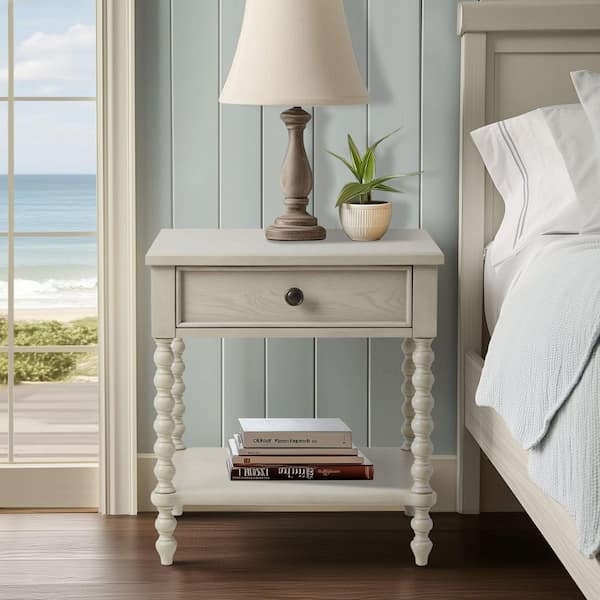Elegant Nightstand with Turned Legs and Metal Ring Pull