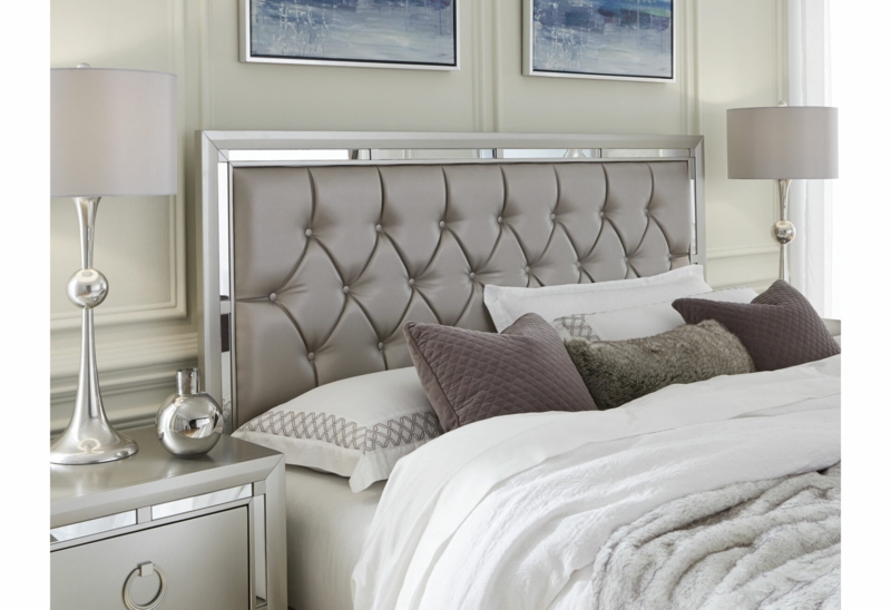 Glam Bed Frame Detail with Beveled Mirror Trim and Upholstered Panel
