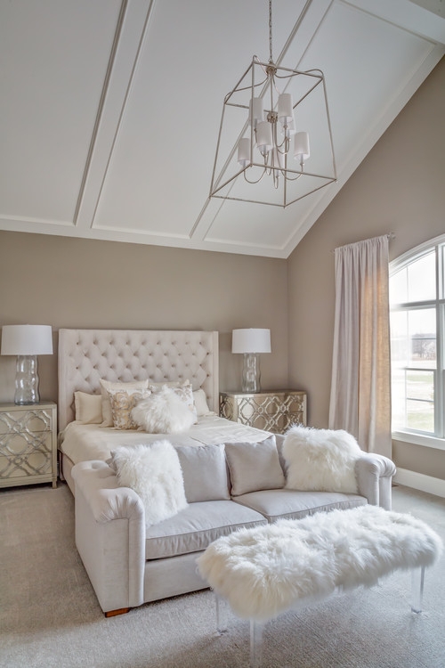 Gray Upholstered Bed With Tufted Headboard And Gold Hardware