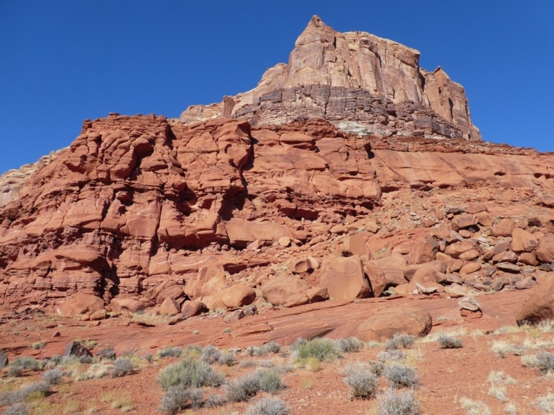 Massive Stratified Rust-Colored Rock Formation