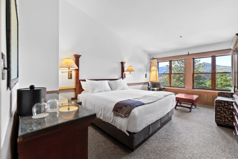 Mountain Modern Bed Exposed Beams Stone Fireplace Vaulted Ceiling