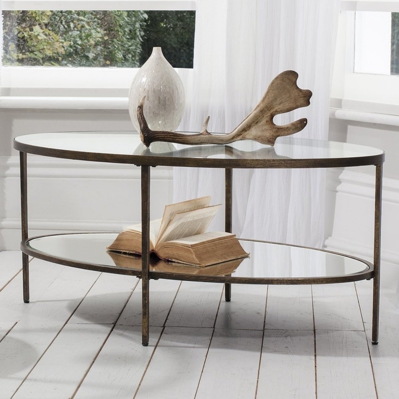 Oval Coffee Table Slender Legs Aged Finish Crossed Base