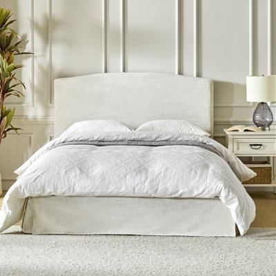 Platform Bed featuring Floor Length Skirt and Cream Slipcover