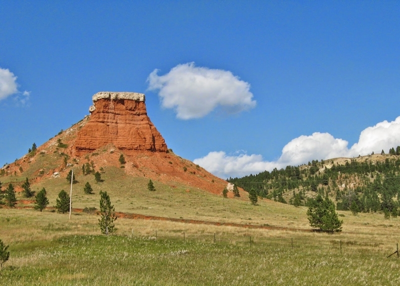 Red Sandstone Butte with Sheer Cliff Face Horizon View