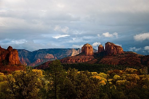 Red Sandstone Mesas with Lush Desert Greenery Landscape