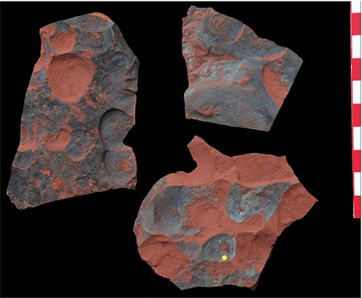 Rugged Terracotta Rock Formation with Exposed Bedrock