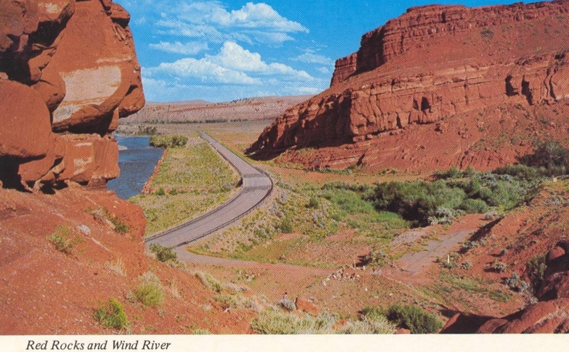 Rust-Toned Rock Cliffs and River Valley Vista