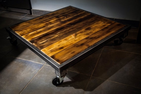 Rustic Wood Plank Coffee Table with Oversized Casters & Industrial Frame