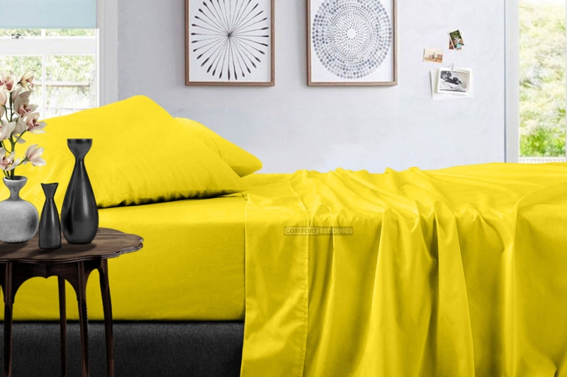 Vibrant Yellow Bed Sheet Set contrasting with Dark Charcoal Walls