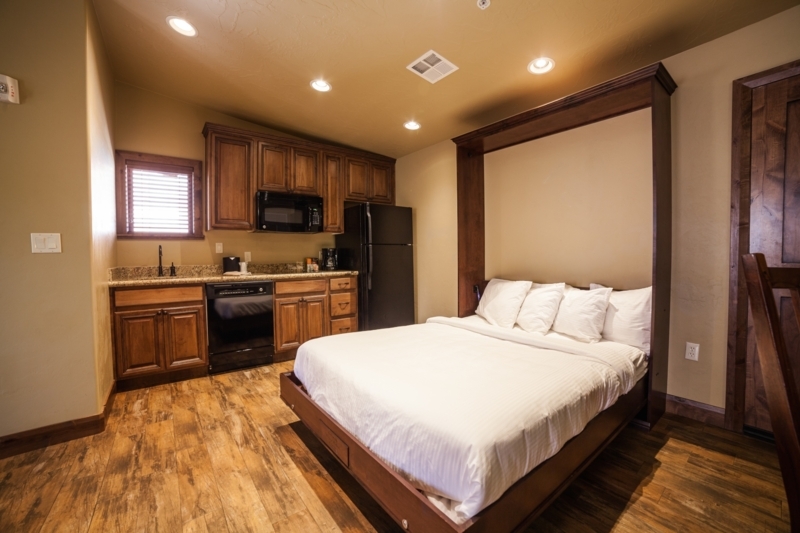 Wall Bed Integrated Cabinetry Wood Toned Small Space Murphy Layout