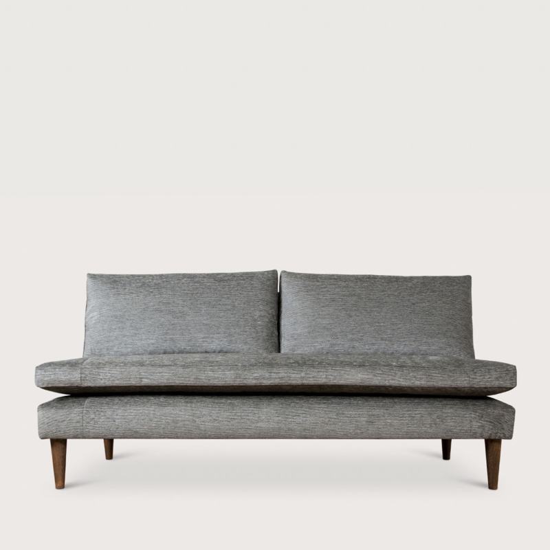 Armless Sofa with Textured Gray Upholstery and Loose Back Cushion