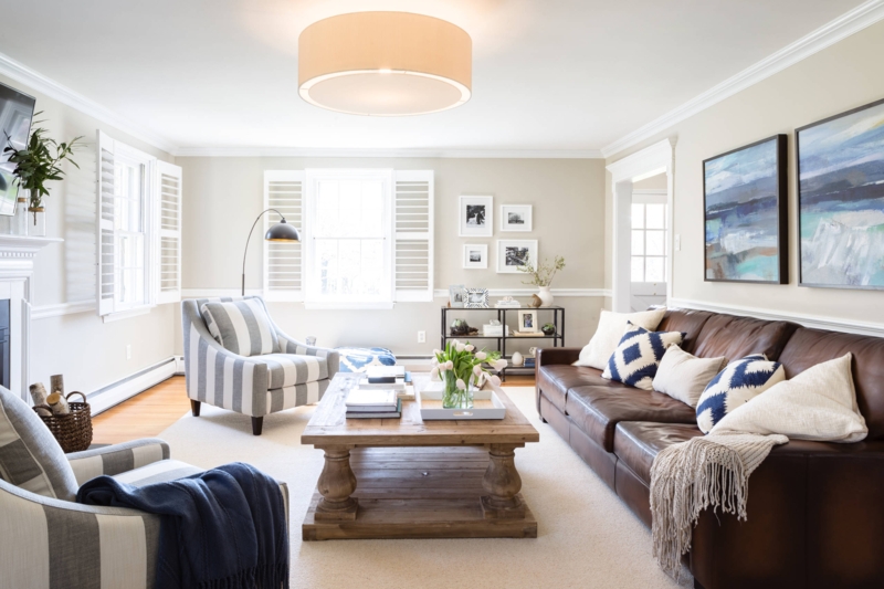 Beige Sectional Sofa With Slab Coffee Table and Built-in Shelving