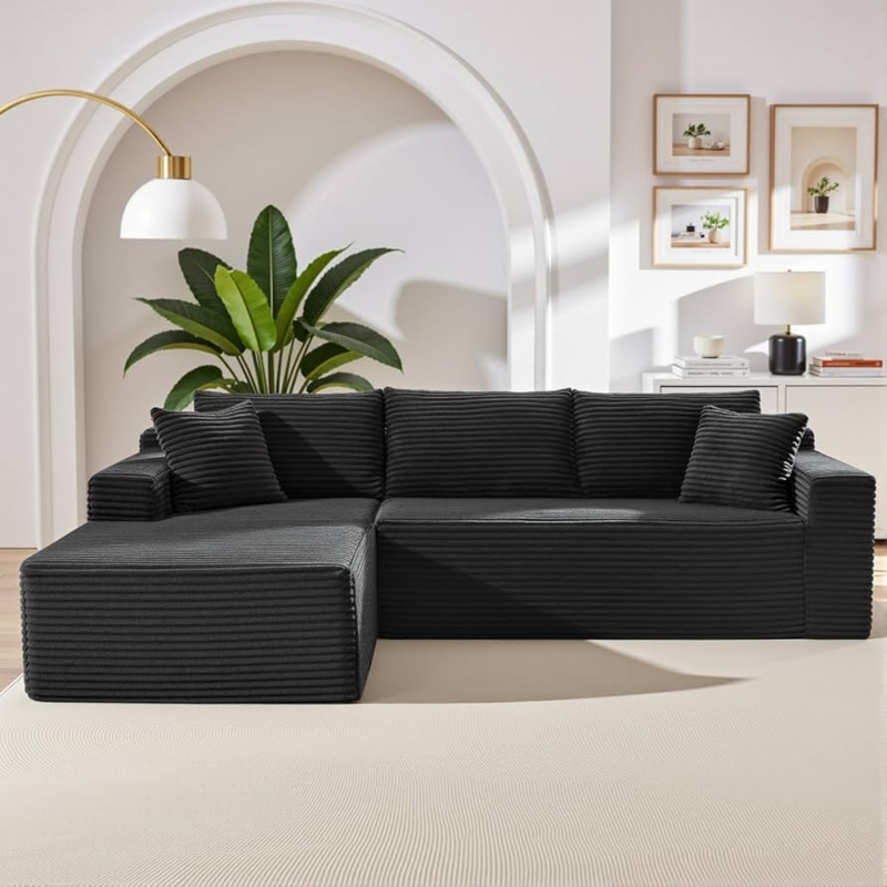 Black Sectional Sofa, Deep Lounging Proportions, Matte Corduroy Texture.