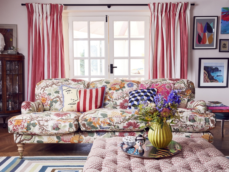 Bold Patterned Sofa with Abstract Print and Teal Accent Wall