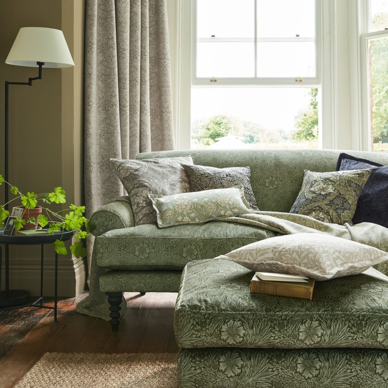 Botanical Floral Upholstered Sofa against Teal Accent Wall