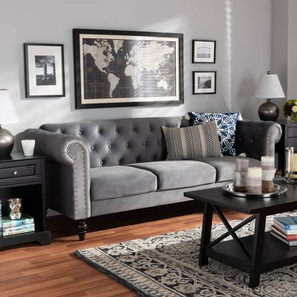 Charcoal Grey Chesterfield Sofa styling with silver nailhead accents.