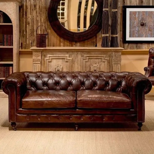 Cognac Leather-Like Sofa with Distressed Finish and Caster Wheels