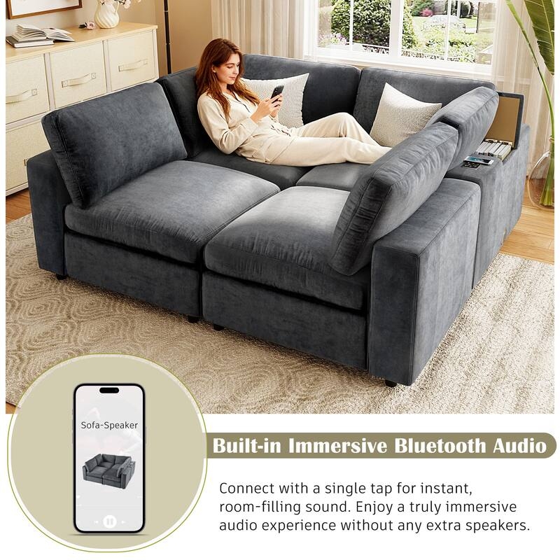Expansive Modular Sectional Sofa with Integrated Console in Beige Fabric.