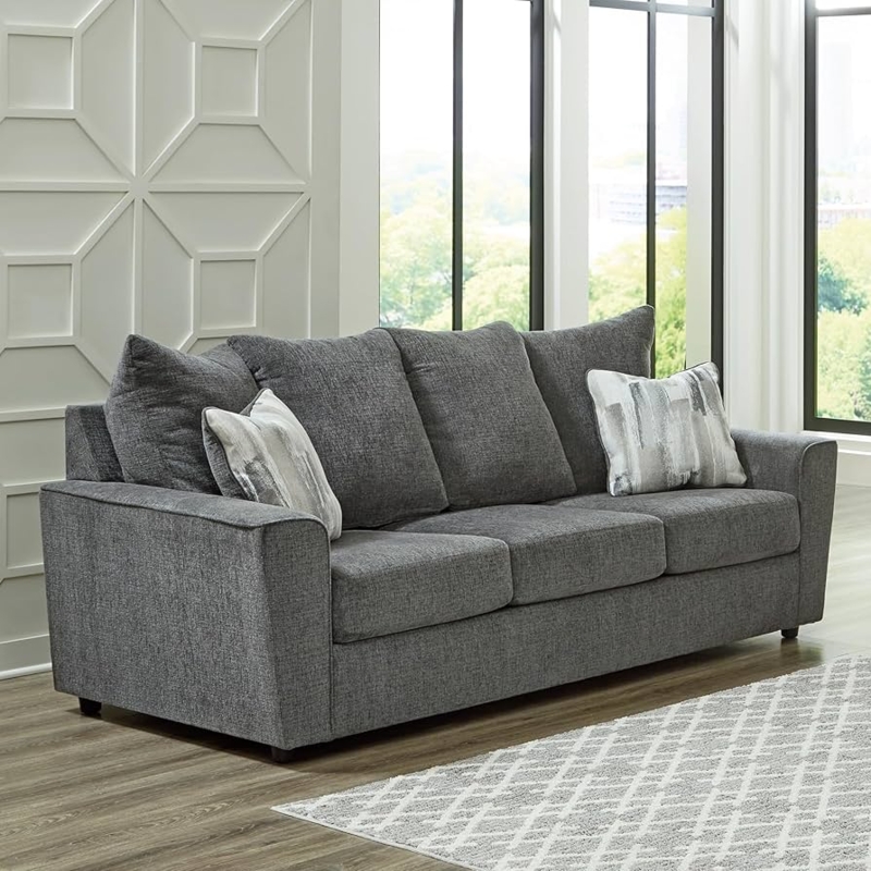 Flared Arm Sofa featuring Box-Border Cushions & Geometric Pillows