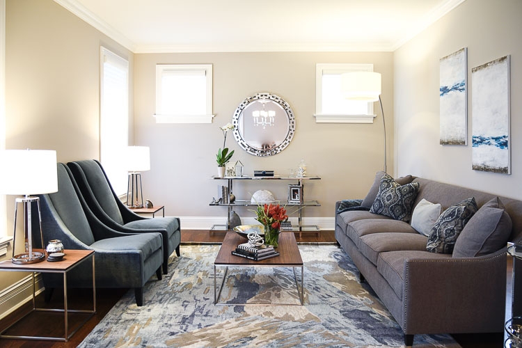 Grey L-Shaped Sectional Sofa against Navy Accent Wall with Shag Rug