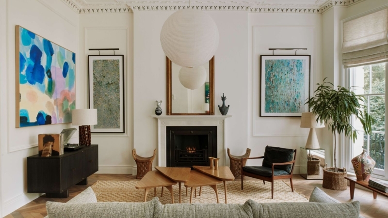 Ivory Sofa Symmetrical Seating Arrangement With Ornate Gold Mirror