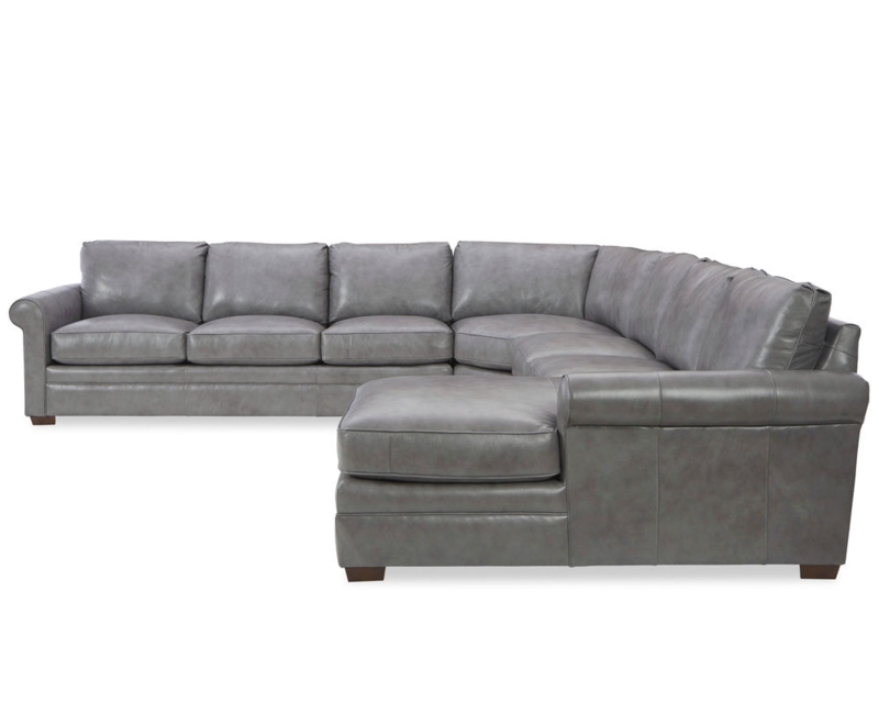 L-Shaped Sectional Sofa, Cognac Leather-Like in Fireplace Setting