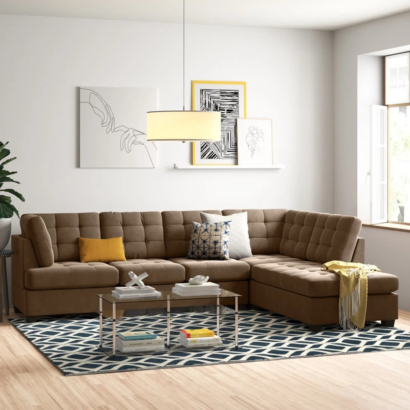 Large Sectional Sofa Featuring Tufted Cushions And Bolster Pillows