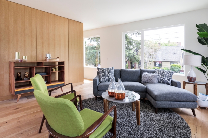 Living Room with Geometric Rug, Terracotta Accents, Tapered Legs