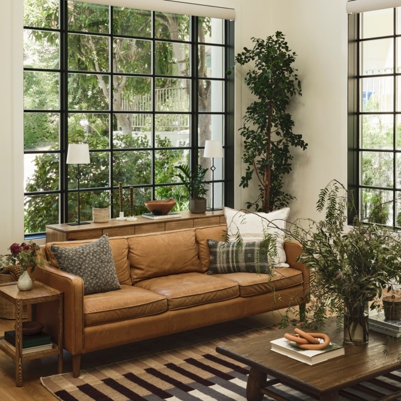 Low Profile Tan Leather-Like Sofa, Slatted Wood Accent Wall