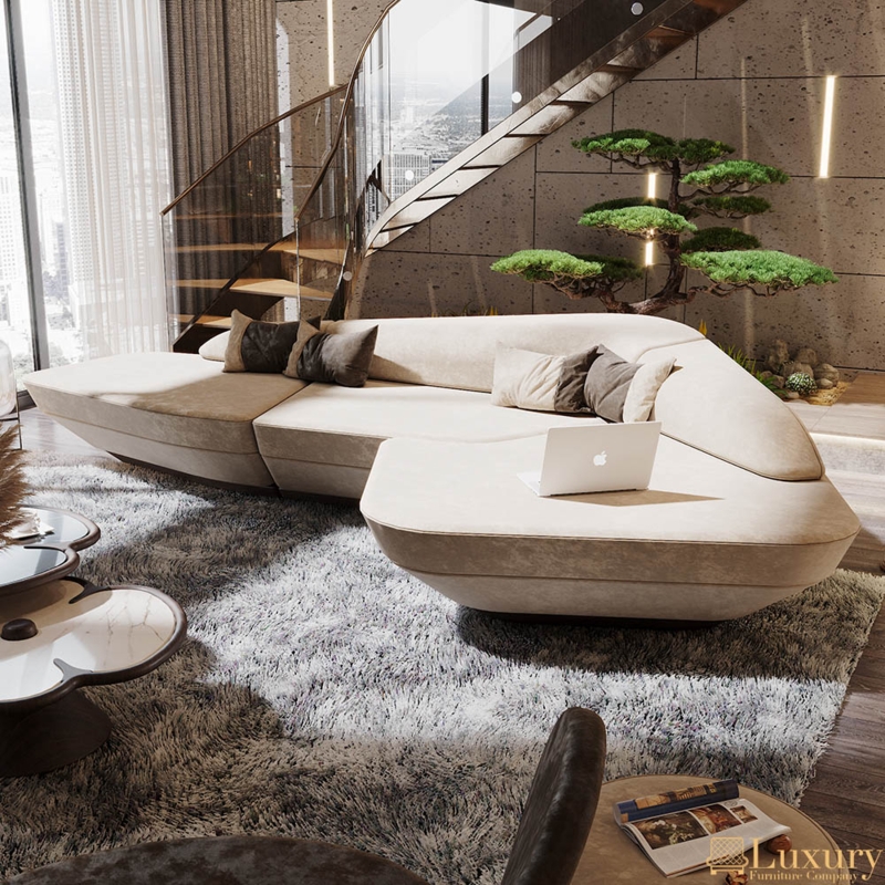 Luxury Curved Cream Sofa with Polished Gold Plinth Base