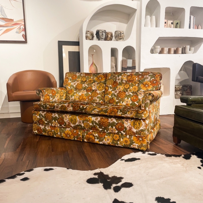 Maximalist Botanical Print Sofa with Gold Tapered Legs and Curved Back