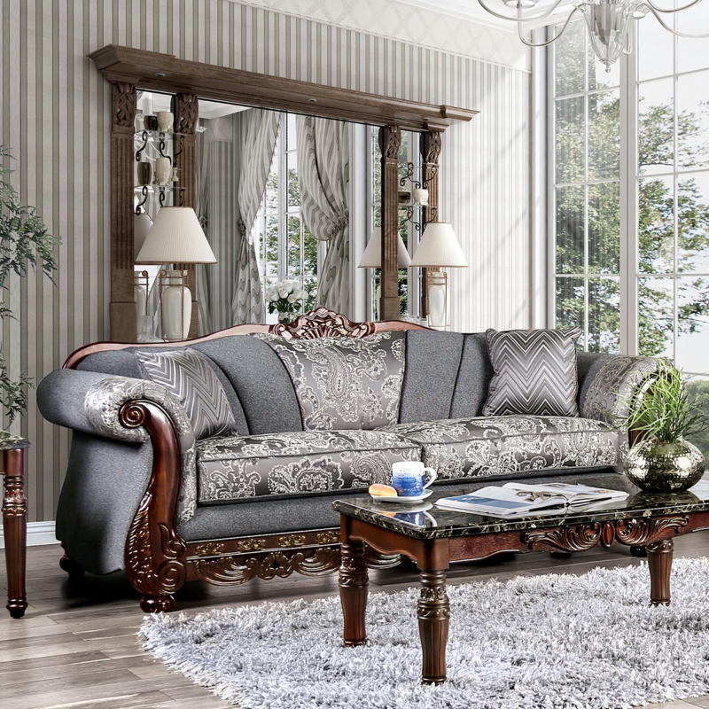 Minimalist Gray Couch with Bolster Pillows and Tapered Legs