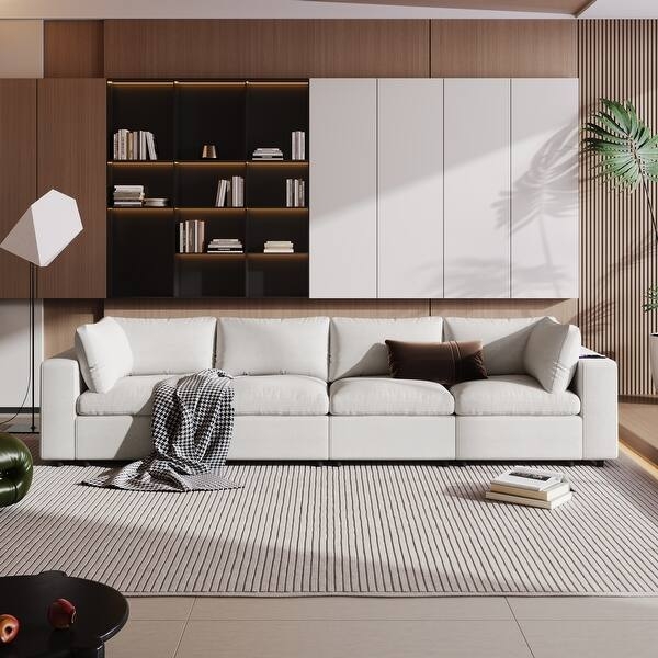 Modular Sectional Sofa with Low Profile Design in Neutral Beige Fabric.