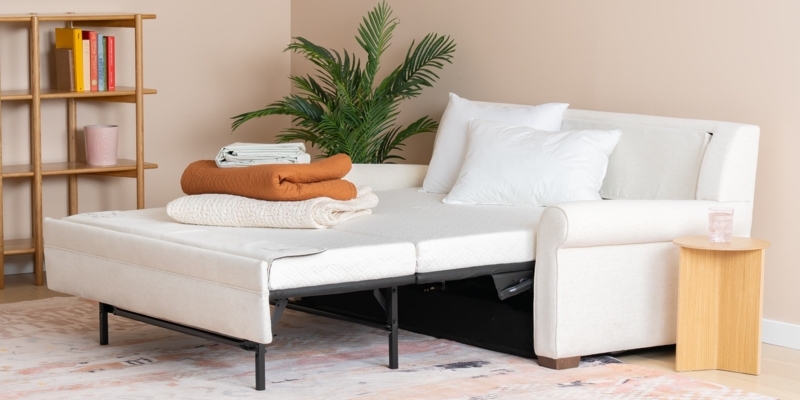 Navy Blue Sleeper Sofa in Modern Living Room Setting