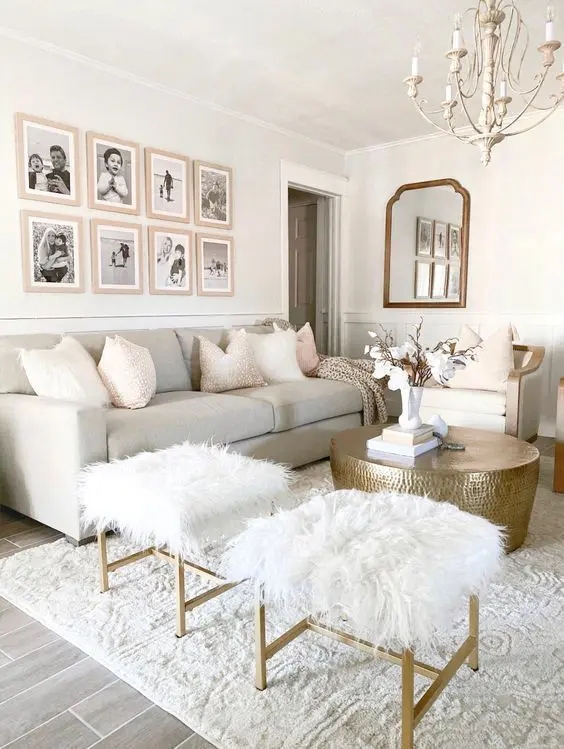 Neutral Curved Sofa Styling Fluted Wall Paneling Brass Accents