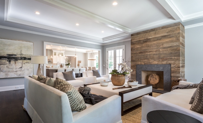 Neutral Family Room featuring Leather Strapped Accent Chair and Media Wall