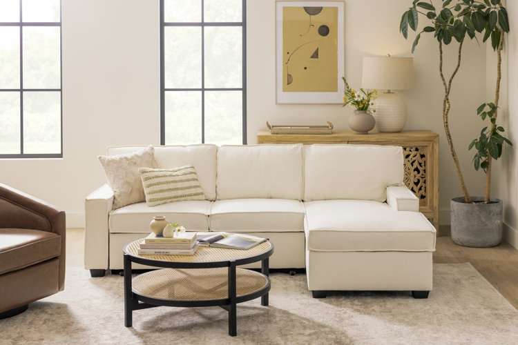 Neutral Sectional with Patterned Chairs in a Transitional Living Room