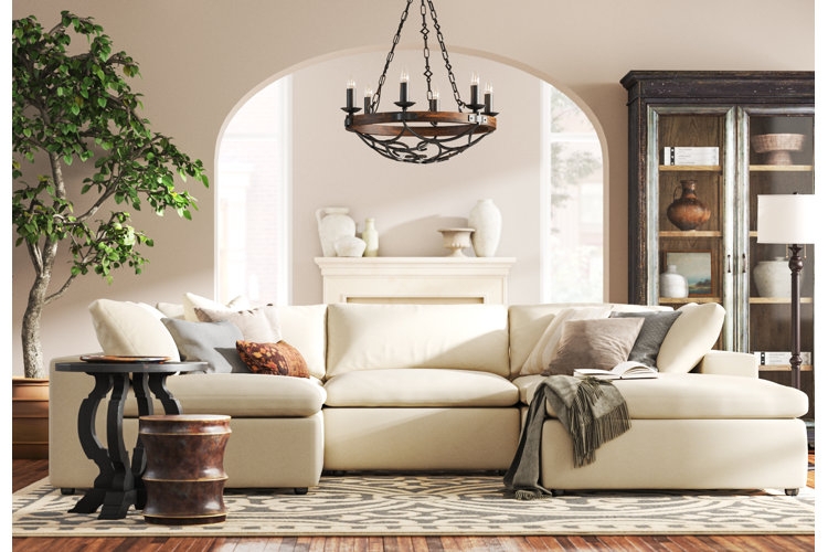 Neutral Sofa With Patterned Accent Chairs and Stone Top Table