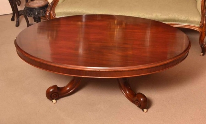 Ornate Oval Coffee Table with Carved Knees and Stretcher Base