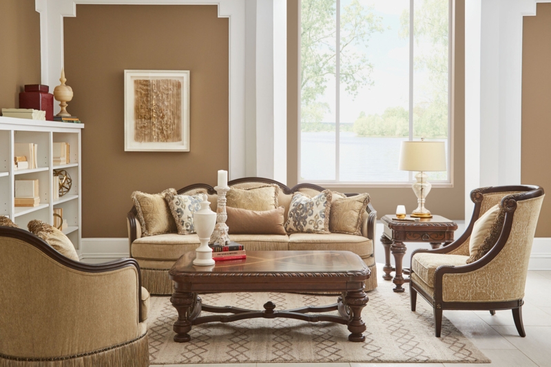 Ornate Transitional Sofa: Azure Blue Tufted Upholstery, Gold Scrollwork Frame
