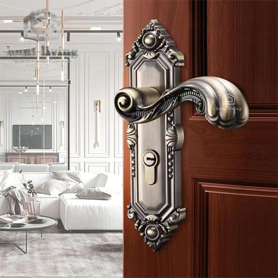 Ornate Victorian Door Handle with Scroll Motif in Antique Bronze