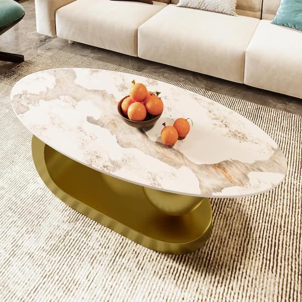 Oval Coffee Table with Geometric Gold Legs and Marbling Pattern