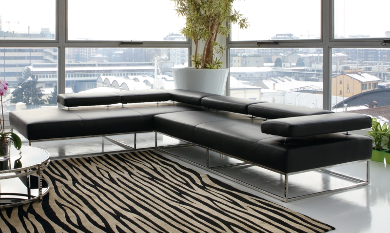 Sectional Sofa: Black Leather-Like with Adjustable Headrests & Chaise