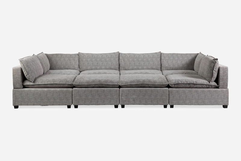Sectional Sofa In Textured Fabric With Pit Configuration Layout.