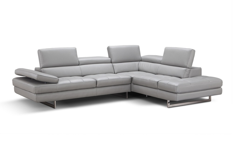Sectional Sofa with Adjustable Headrests and Polished Metal Legs.