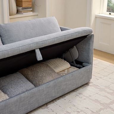 Storage Sofa with Shelter Arms on Wood Toned Plinth Base