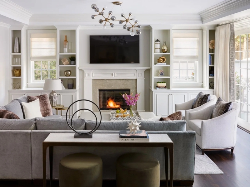 Symmetrical Armchair Living Room styling with white fireplace mantel.
