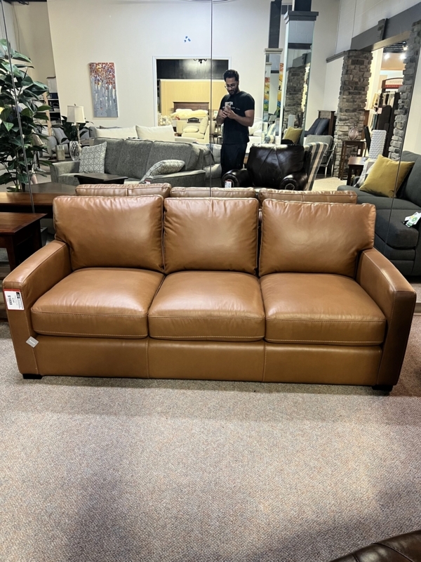 Traditional Rolled Arm Sofa featuring Block Feet and Tan Fabric