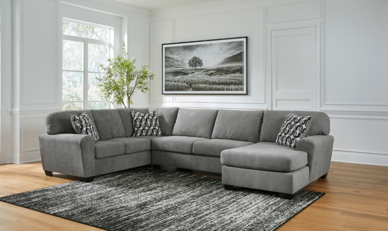 U-Shaped Sectional Sofa with Scatter Back Cushions and Integrated Chaise.